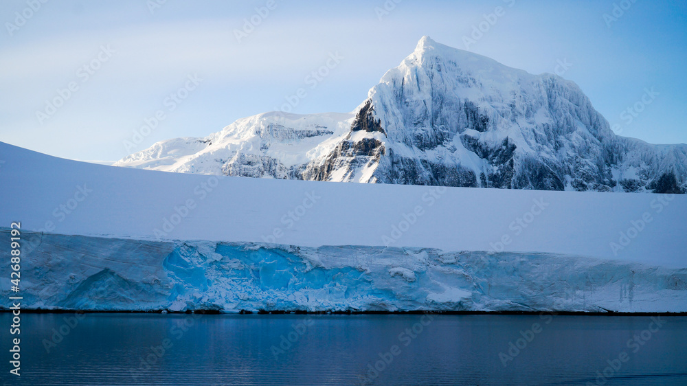 Snow covered Mountains and Icebergs in the Antarctic Peninsula on Antarctica. Snow covered Mountains and Icebergs in the Antarctic Peninsula on Antarctica.