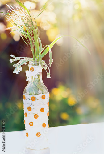 DIY old empty bottles can be used for event decoration as a flowers vases