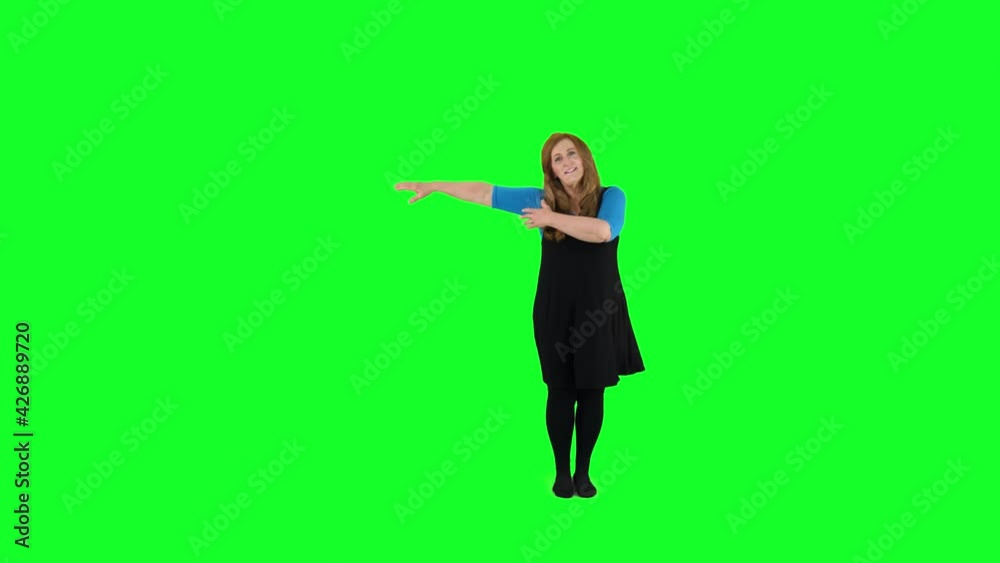 Senior teacher slides and glides teaching how to dance in front of a green screen. Senior teacher slides and glides teaching how to dance in front of a green screen.