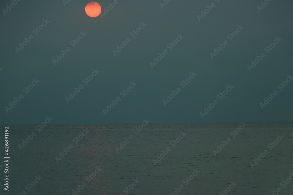 Sunset on the beach over sea Sunset on the beach over sea