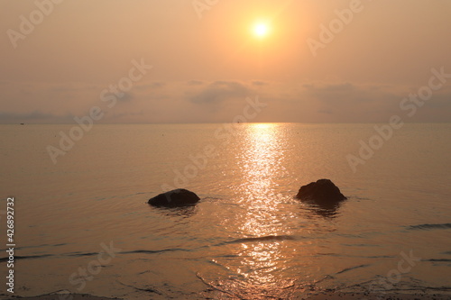 Sunset on the beach over sea © Sohel