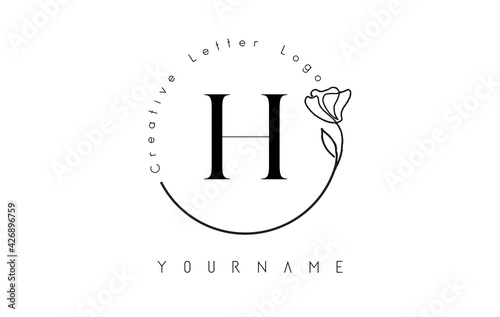 Creative initial letter H logo with lettering circle hand drawn flower element and leaf. photo
