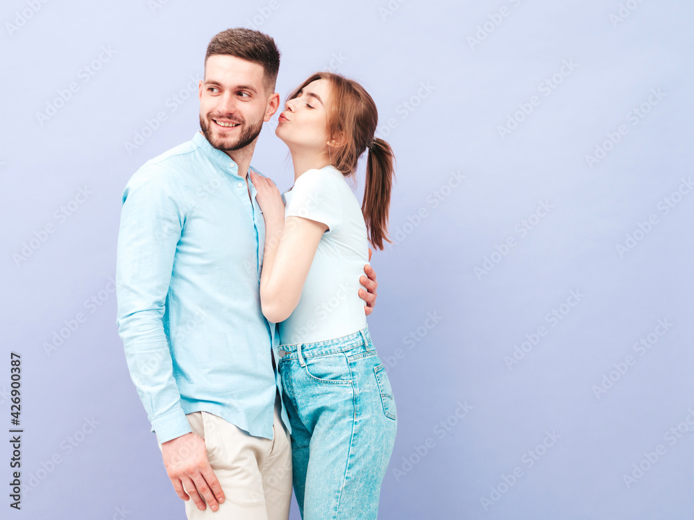 Smiling beautiful woman and her handsome boyfriend. Happy cheerful family having tender moments near purple wall in studio.Pure cheerful models hugging.Embracing each other Smiling beautiful woman and her handsome boyfriend. Happy cheerful family having tender moments near purple wall in studio.Pure cheerful models hugging.Embracing each other