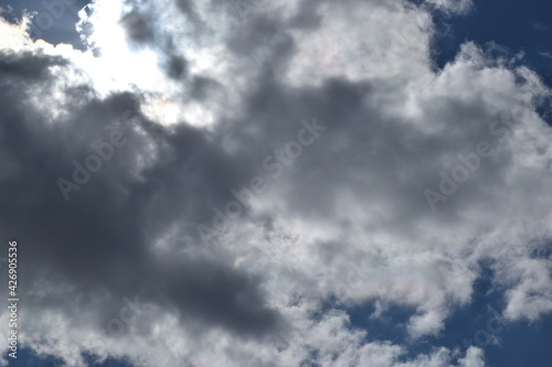 The sun hid behind dark clouds.