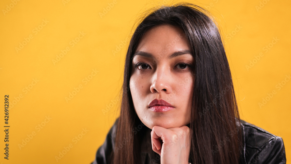 Portrait of a young beautiful woman against a neutral background - studio photography