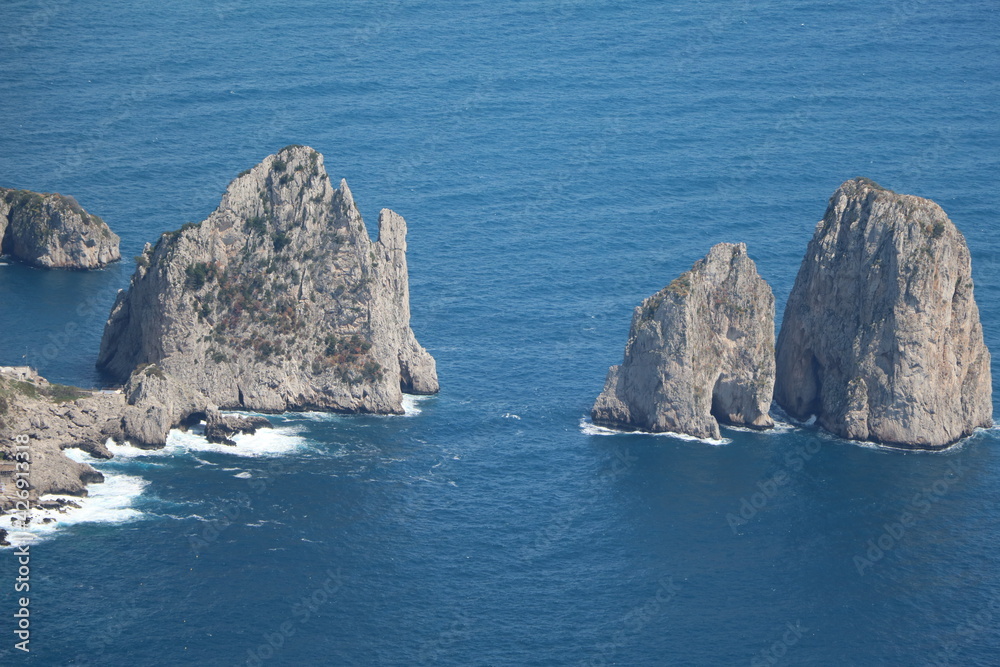 The four Faraglioni in front of Capri, Italy