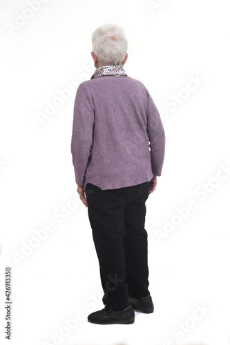 full portrait of a senior woman rear view on white background