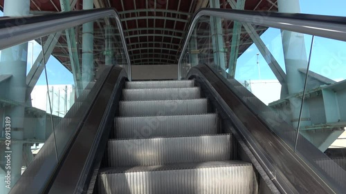 Ascending escalator photo