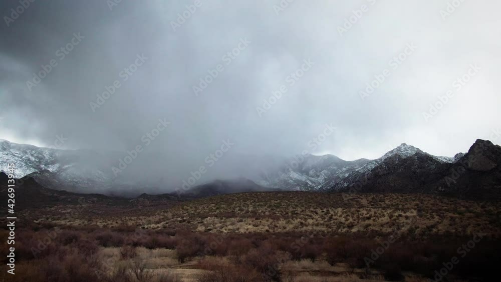 Rain clouds over snowy Arizona mountain Rain clouds over snowy Arizona mountain