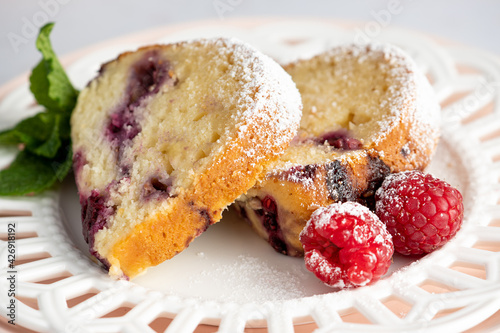 Raspberry Breakfast Bundt Cake slices with raspberry garnish. © Debbie B