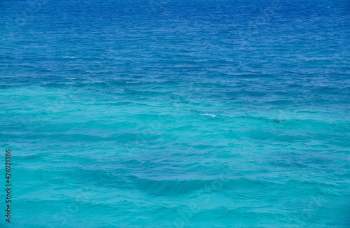 Red Sea background, clean blue water, small waves © Artcomma