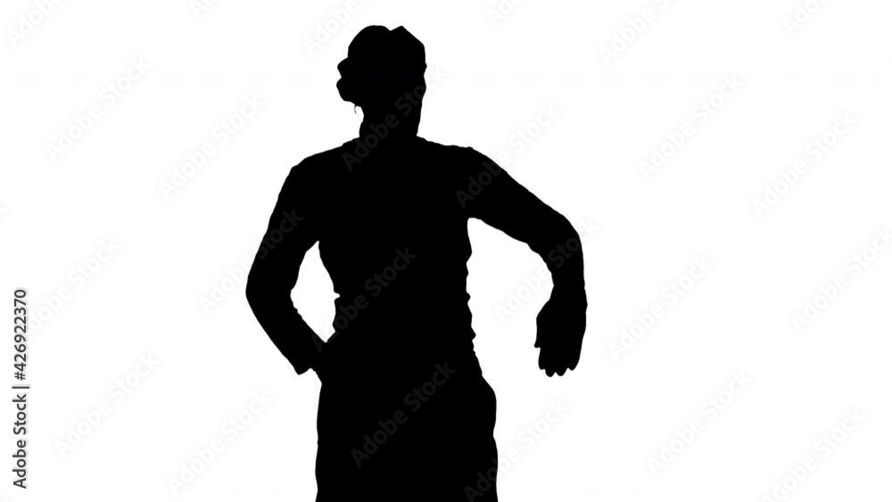 Silhouette Man dressed like mime looking far away. Silhouette Man dressed like mime looking far away.