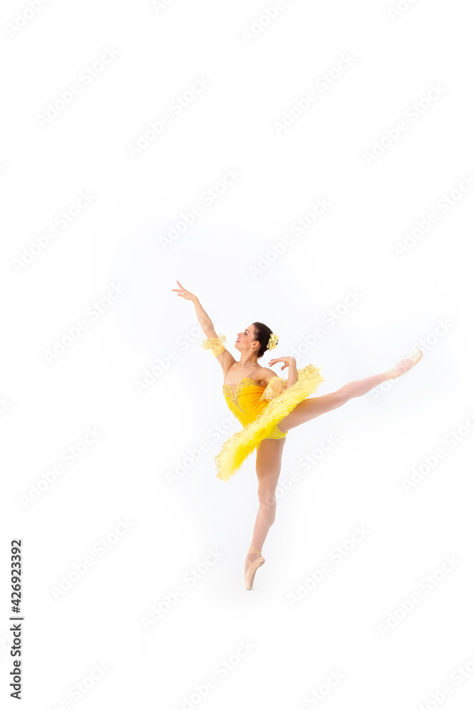 Young modern ballet dancer in yellow dress isolated on white background