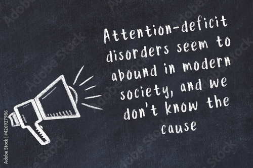 Canvas Print Chalk loudspeaker and wise quote on black desk