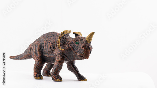 isolated plastic toy dinosaur on white background