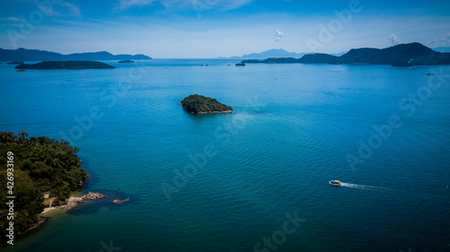 In the early morning hours, the sunlight illuminates the sea of the Angra dos Reis bay and its beaches, Rio de Janeiro - Brazil