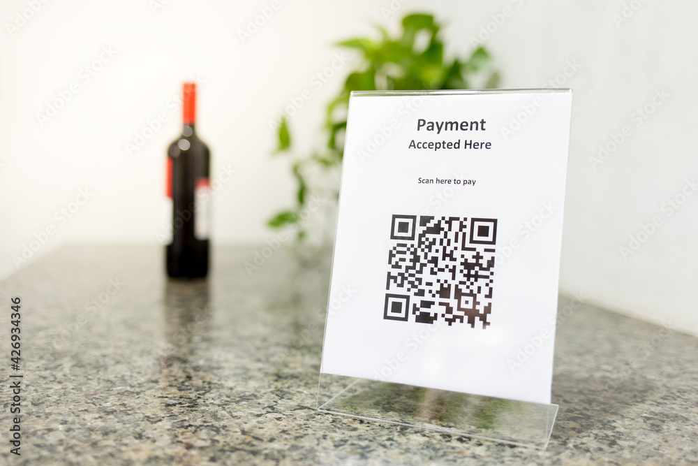 Sign with a QR Code to generate payment in a bar. Cashless technology ...