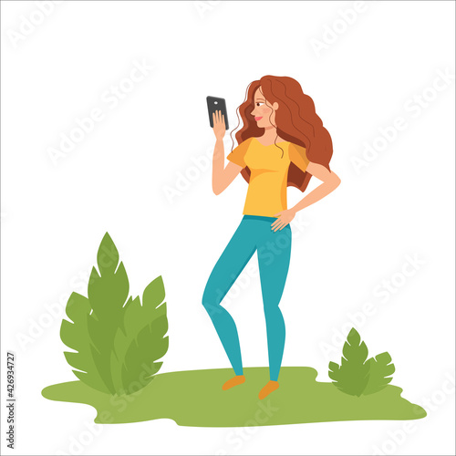 Woman communication with smartphone in summer park. Female using phone. Beautiful young girl outdoors chatting online over the internet or taking selfies