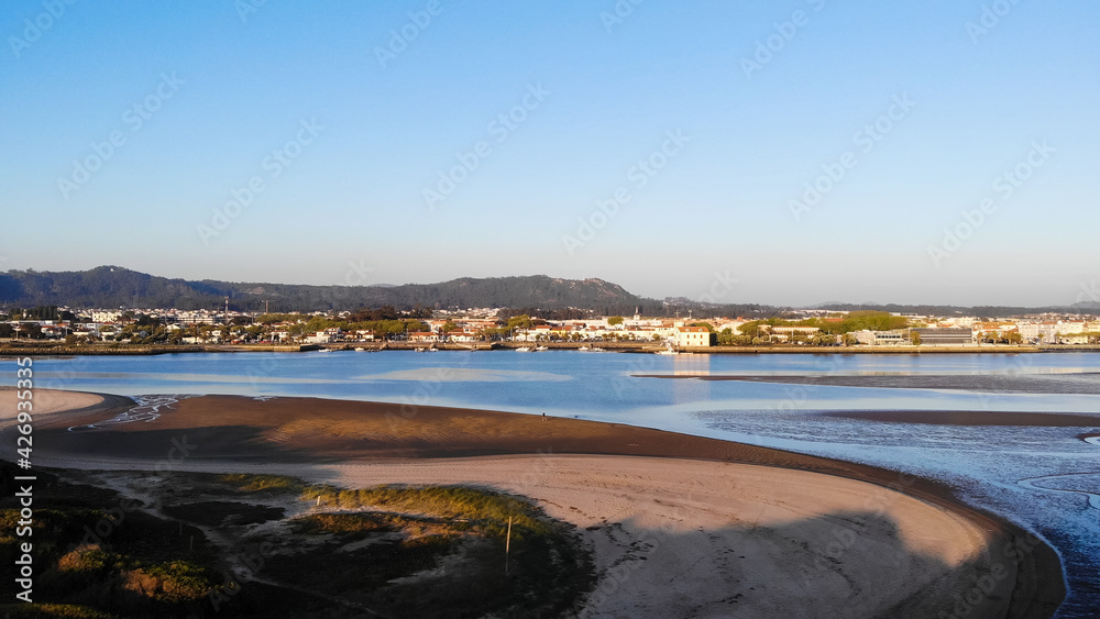 DRONE AERIAL FOOTAGE - The Northern Litoral Natural Park in Ofir, Esposende, Portugal. The Cavado River estuary at sunset.