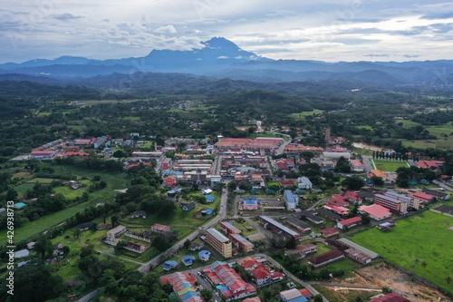 aerial view of tuaran town with mount kinabalu on background © Mohd Khairil
