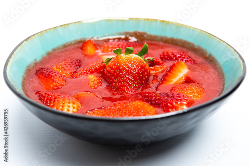 strawberry smoothie in white background. spring or summer healthy food concept. real food