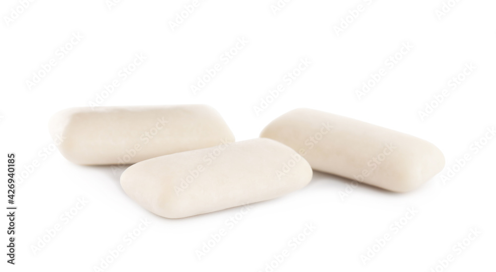 Three sweet chewing gum pieces on white background