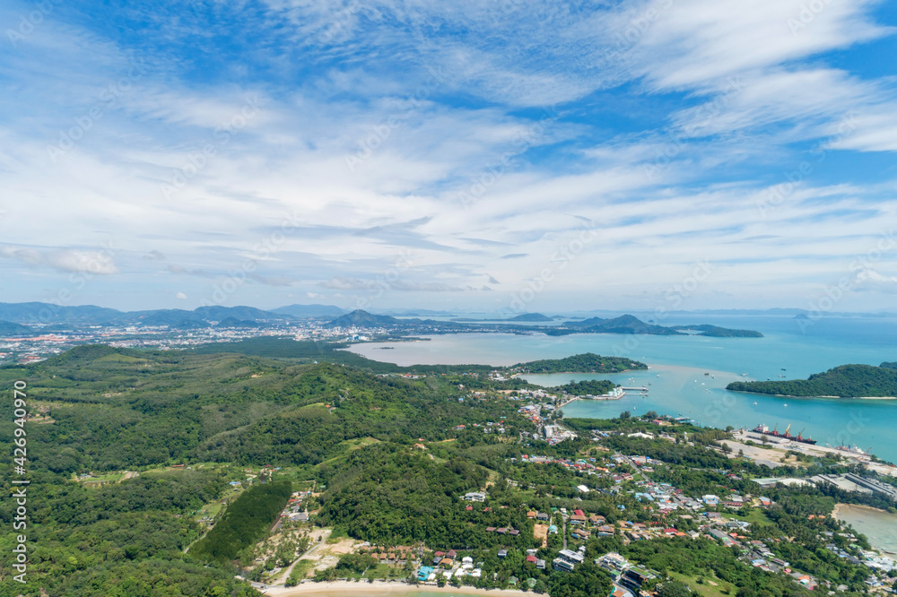 Aerial view of beautiful tropical island with Blue sky over port harbor in Phuket Province Thailand Panoramic landscape Aerial Shot