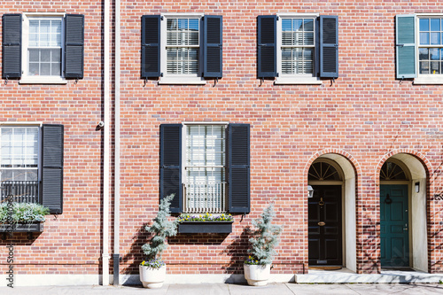 Front of brownstone apartment building in Center City with windows, stoops and planters in Pennsylvania © Renata