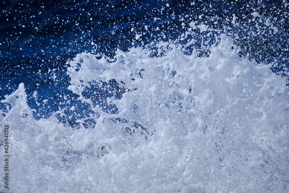 Ocean water splash isolated on white sea foam