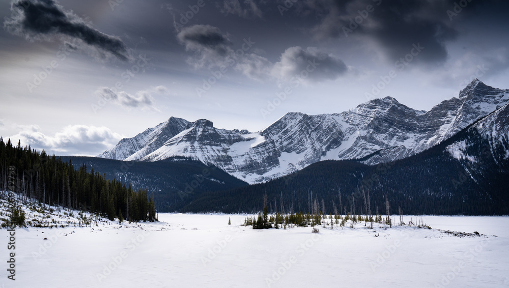 A frozen mountain lake in the Canadian Rocky Mountains in Kananaskis Alberta A frozen mountain lake in the Canadian Rocky Mountains in Kananaskis Alberta