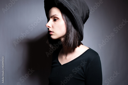 woman in black clothes on gray background