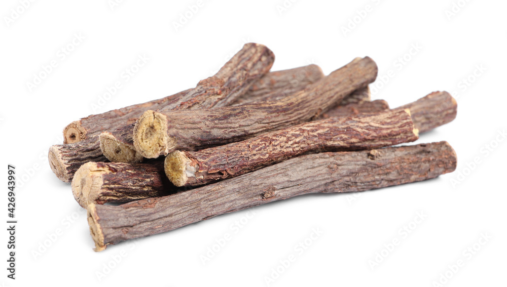 Dried sticks of liquorice root on white background Dried sticks of liquorice root on white background