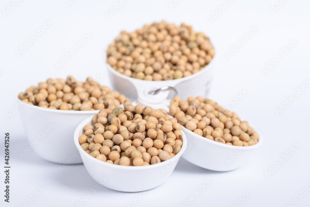 Soybean seeds in a bowl on white background Soybean seeds in a bowl on white background