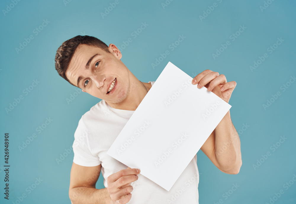 Handsome guy with white sheet of paper advertising mockup Copy Space Handsome guy with white sheet of paper advertising mockup Copy Space
