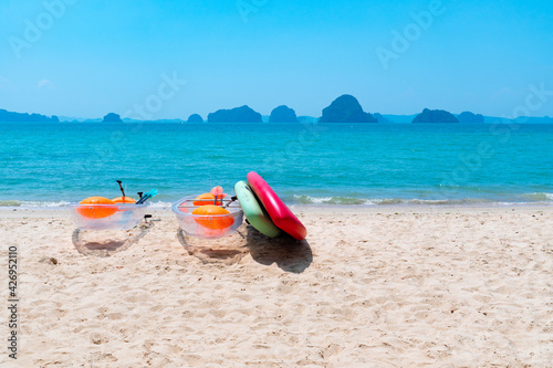 landscape of boat and surfboard on the white beach and blue sea preparing for traveler