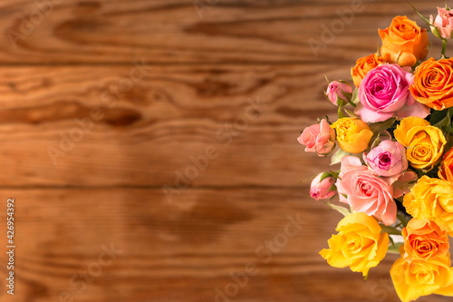 bouquet of roses on the old wooden table  © hirobirock