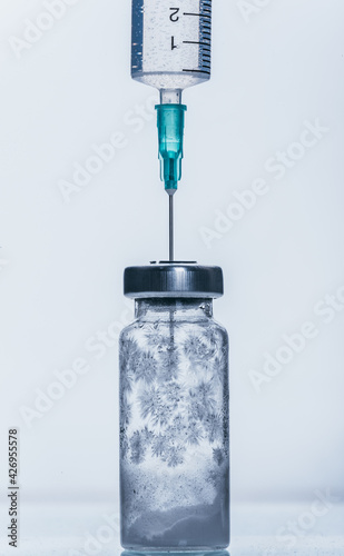 Medicine, Injection, vaccine and disposable syringe, drug concept. Sterile vial medical syringe needle. Glass medical ampoule vial for injection.