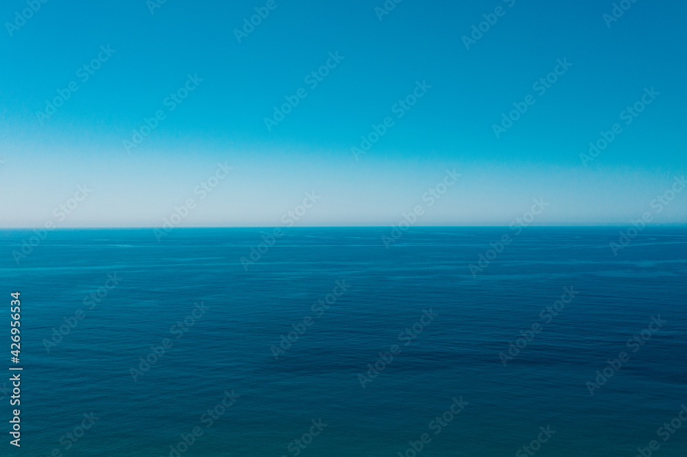 Summer sunny day, blue sky, white clouds and water sea background. Blue Sky Background.