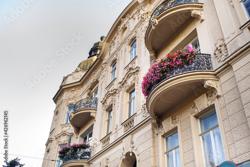 Balconies with flowers in an old house on the street of the city of BRNO .Czech