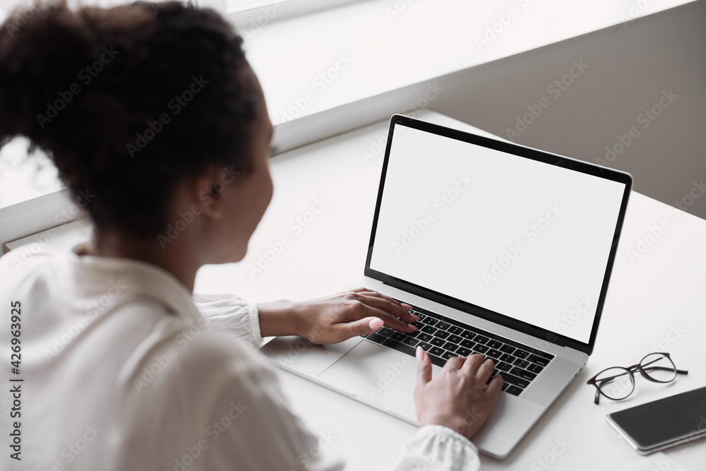 Young woman using laptop computer at home. Business woman working in office. Freelance, student lifestyle, e-learning, studying, web site, technology and online shopping concept Young woman using laptop computer at home. Business woman working in office. Freelance, student lifestyle, e-learning, studying, web site, technology and online shopping concept
