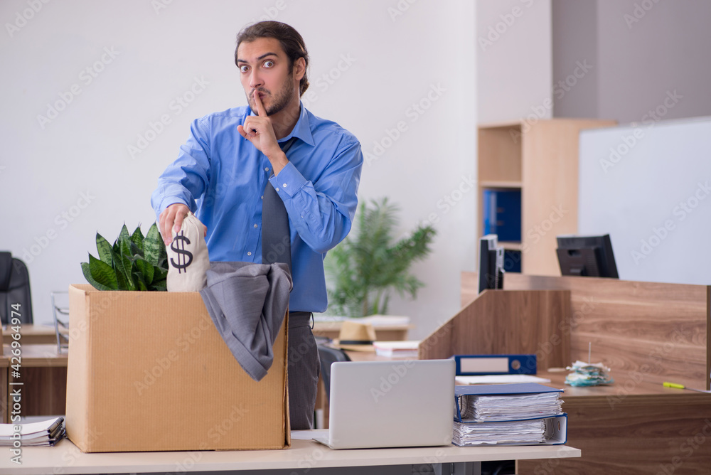 Young male employee being fired from his work Young male employee being fired from his work
