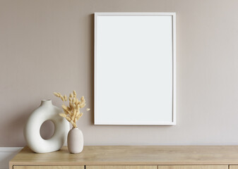 Blank picture frame mockup on gray wall. White living room design. View of modern scandinavian style interior with artwork mock up on wall. Home staging and minimalism concept