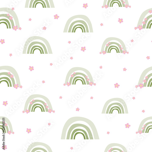 Cute seamless pattern of green rainbows with pink flowers. Boho print, texture from rainbows, wallpaper for nursery. Scandinavian boho style, children's print, pastel colors. For baby fabric, textile.