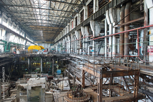 Petropavlovsk, Kazakhstan - 05.26.2015 : The territory of the power plant with large industrial compartments for turbine generators and pipes.
