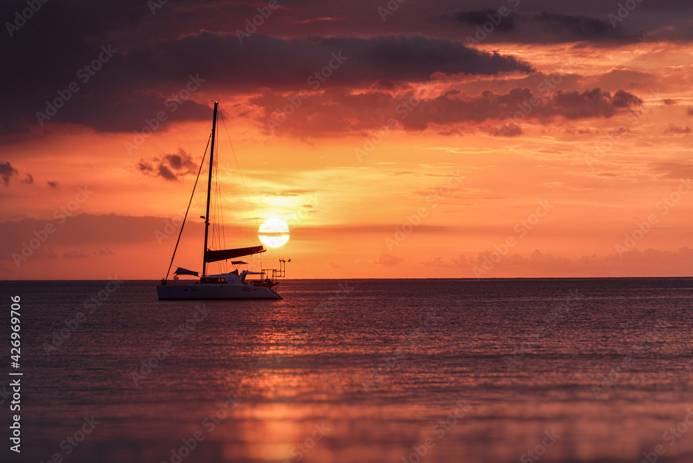 Silhouette of a luxurious yacht on the sea empty in sunset time. Economy effect due to covid to tourist attractions are empty in Thailand Silhouette of a luxurious yacht on the sea empty in sunset time. Economy effect due to covid to tourist attractions are empty in Thailand