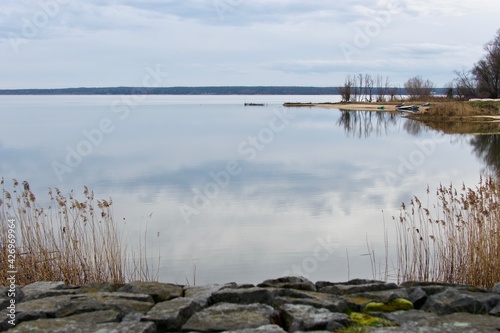 Lake Turawa in Poland on a cloudy day, calm water with nice reflection of clouds photo