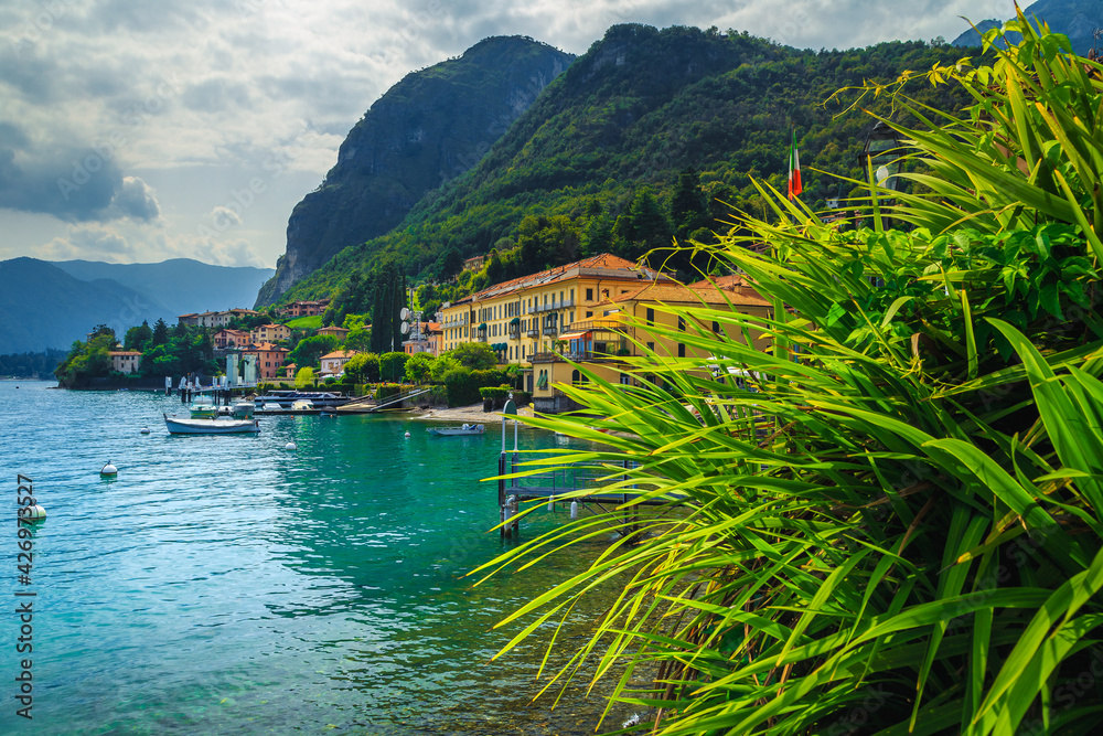 Holiday villas and boats on the shore of lake Como