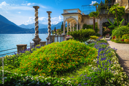 Cute ornamental garden of villa Monastero with lake Como, Italy photo