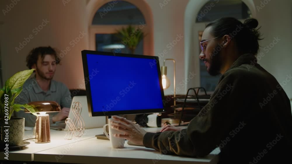 Company workers prepare startup project sitting at computers