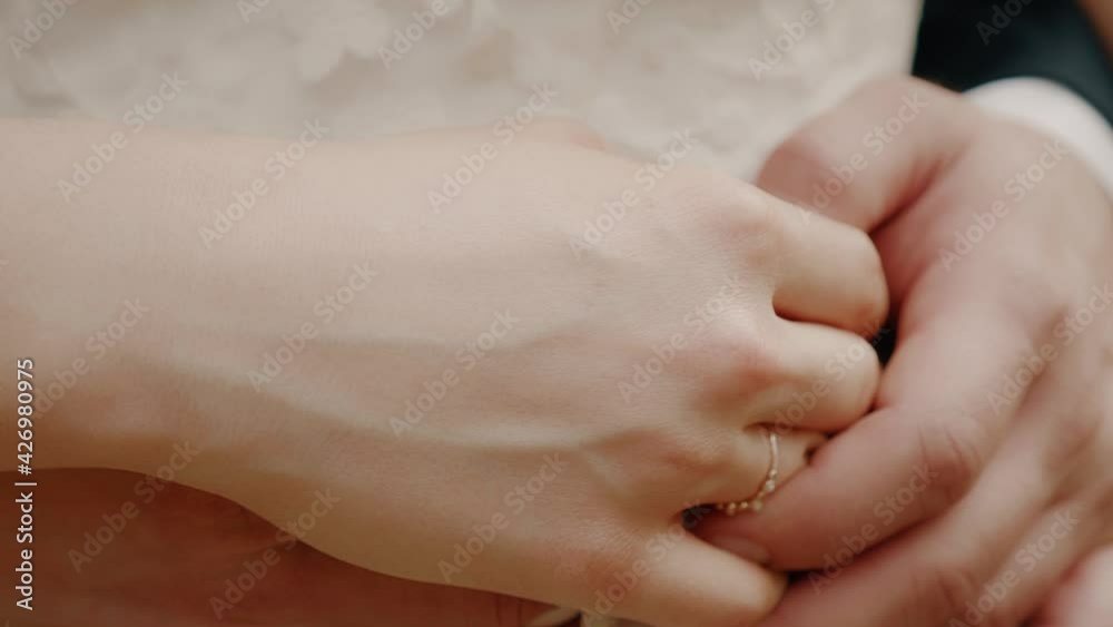 Male hands hug female wearing bridal rings enamored couple just married wedding day ceremony Male hands hug female wearing bridal rings enamored couple just married wedding day ceremony